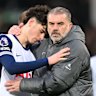 Ange Postecoglou consoles Archie Gray after Spurs loss.