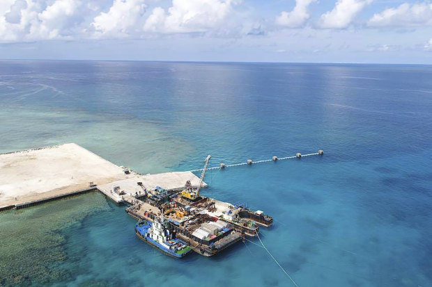 Ships carrying building materials docked at a new beach ramp at the Philippine-claimed island of Pag-asa, also known as Thitu, in the South China Sea in June, 2020.