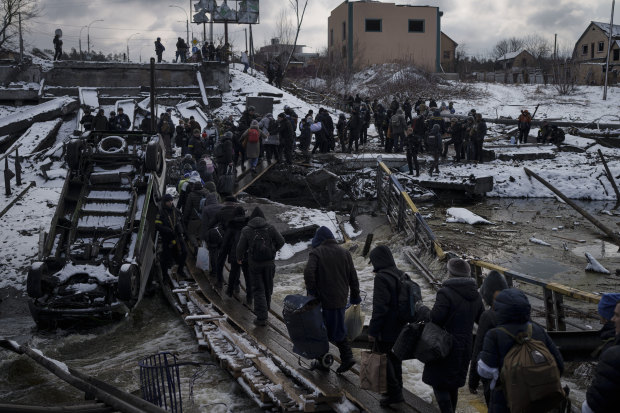 People flee Kyiv on March 8.