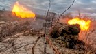 A Russian soldier fires an anti-tank missile at an undisclosed Ukrainian target.