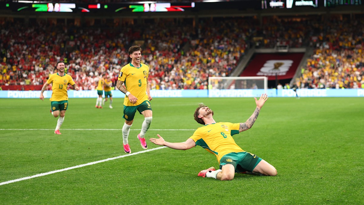 Inside the wild pitchside mania of iconic Socceroos moment