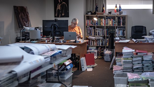 Ken Wyatt in his study surrounded by “native welfare” files. Spanning a century, they show in painful detail how cruel policies affected four generations of his family.