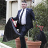 AFP officers depart after the raid on the home in Canberra.