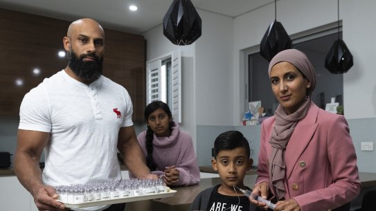 Ismaeel Ahmad (centre front) and his father Usman (left), mother Javeria (right) and sister Rumaysa (back) at their Merrylands home.