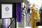 The Queen makes a rare public foray to inaugurate the new London Tube line named in her honour.