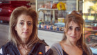 Melbourne cafe owner Vivianne Hadla (right) and her cousin Georgina Farah (left) are only allowed to serve take away.