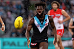 Justin McInerney of the Swans competes with Martin Frederick of the Power in 2021.