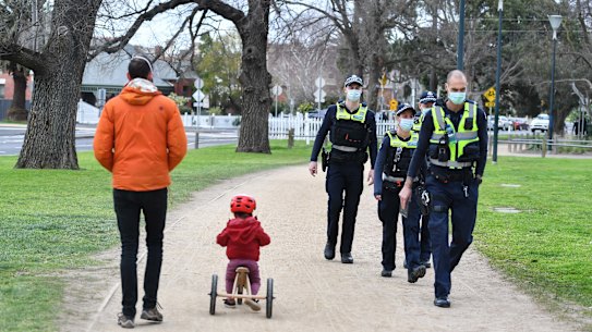 Police patrol Princes Park in Carlton on Tuesday morning.