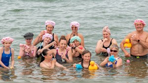 Local residents “bathe” in the sea in Whitstable in Kent to protest against disruption to their water supplies. 
