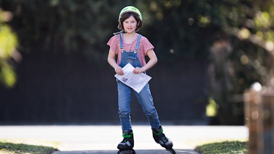 Frankie delivers her newspaper, the Cheer Up Weekly. 