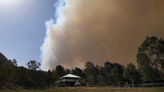 Smoke from an out-of-control bushfire is seen near Clumber, Queensland, Friday, November 8, 2019. Extreme fire warnings are in place for parts of south east Queensland with high temperatures and strong winds. (AAP Image/Dan Peled) NO ARCHIVING