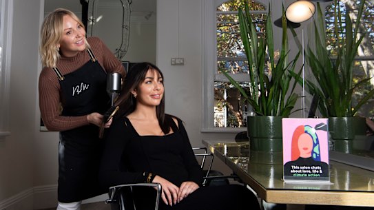 Penny Jennifer Garry (standing) with Barney Martin manager Wednesday Hulme. Both women participated in training for hairdressers in how to talk about climate action with their clients.