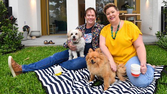 John and Ashka Broeksema, with dogs Murphy and Ziggy, at their new home in a build-to-rent apartment tower at Sydney Olympic Park. 