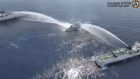Image from video provided by the Philippine Coast Guard of one its vessels being sprayed by Chinese coast guard water cannons this week.