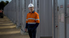 AGL Energy chief executive Damian Nicks at the company’s SA batteries project. The battery, and another in NSW, added $17 million to the company’s bottom line in the first half of the financial year.
