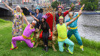 Lord mayor Sally Capp and performers celebrate with Moomba monarchs Kirsty Buising, Pravini Fernando and Drew Law on the banks of the Yarra on Monday.