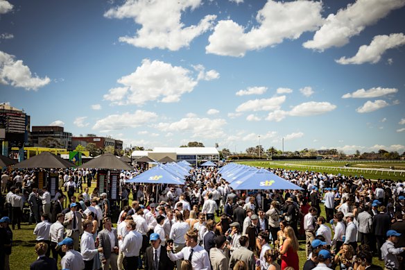 A large crowd enjoying the fine weather.