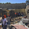 Residents sift through rubble from a destroyed building at the scene of an airstrike in Mekele, in the Tigray region of northern Ethiopia, in late October.