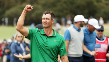 Adam Scott pumps up the crowd after he and Louis Oosthuizen defeated Dustin Johnson and Matt Kuchar at Royal Melbourne.