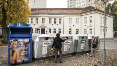 Recycling bins for clear and coloured glass in Potsdam, Germany. Germany sorts 65 per cent of its waste into colour-coded bins: blue for paper, yellow for plastic, brown for composting and black for general waste. 