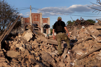 Police investigate a missile strike in Druzhivka, Ukraine, in the Donetsk. 