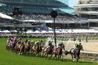 The field round the first bend in the 2021 Melbourne Cup at Flemington.