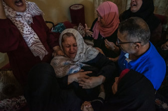 Relatives of Palestinian Ahmed Al-Shenbari, who was killed during an Israeli raid in Beit Hanoun, Gaza, attend his funeral on Tuesday.