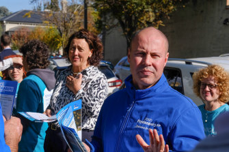 Treasurer Josh Frydenberg and independent Kooyong candidate Monique Ryan handing out flyers at the Hawthorn pre-polling booth on Monday.