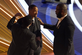 Sean Combs, left, and Tyler Perry, right, with Will Smith.