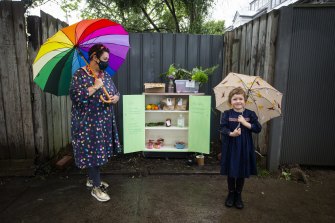 Karan White and her neighbourhood pantry in Hawthorn East, pictured with neighbour Frankie, 4. 