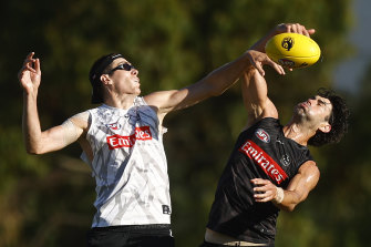 Mason Cox, left, pictured at a February training session. 