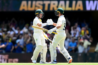 Marcus Harris of Australia and Marnus Labuschagne celebrate Australia’s nine-wicket win.