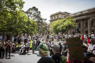 Hundreds of climate change protesters gather on the steps of the State Library of Victoria on Saturday.
