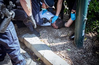 Police make an arrest during a protest on Saturday.