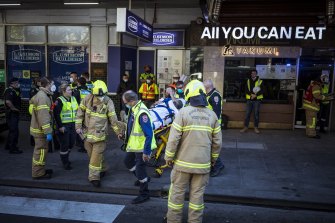 A construction worker is taken away by ambulance after being injured in a worksite incident at a Bourke Street building site on Thursday morning.