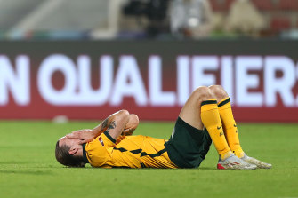 A shattered Jackson Irvine reacts to the Socceroos’ 2-2 draw with Oman.