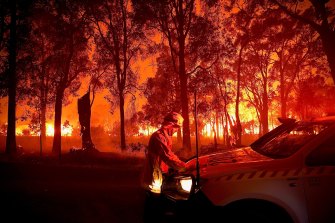 The IPCC report is predicting a drastic rise in severe fire weather conditions. A firefighter takes a moment amid raging bushfires in WA last month.