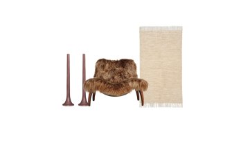 “Tusk Chocolate” candles; “Fantastic Beast Bigfoot” chair; “Melange” rug.