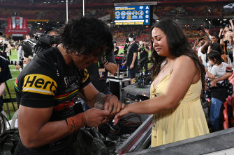 Brian Toâo and Moesha Crichton-Ropati moments after getting engaged at Suncorp Stadium in Brisbane.