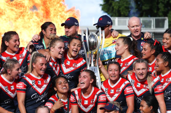 The Roosters celebrate winning the NRLW Premiership.