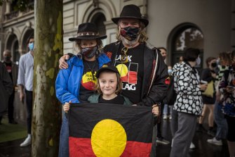 Clint Fisher, Kerry Robinson and  Rufus, 7, at the Invasion Day rally.