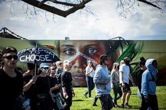 Protesters march through the Botanical Gardens on Saturday.