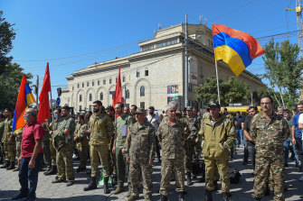 The Armenian government declared martial law on Sunday and mobilised service personnel and volunteers to set off for Nagorno-Karabakh.