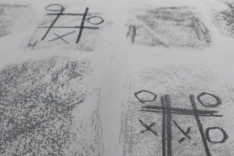 Noughts and crosses games created by artist Lee Hadwin as he slept.
