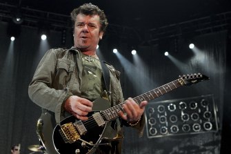 INXS guitarist Tim Farriss performs during a sold-out show in Las Vegas in 2006. He has lost a finger on his left hand, which is used to change notes on the guitar.
