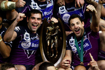 Cameron Smith and Billy Slater celebrate the 2009 grand final victory over Parramatta, which was later stripped from the club for salary cap breaches.