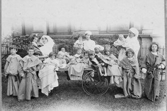 Nurses and patients outside the Royal Exhibition Building during the pandemic. The makeshift hospital catered to up to 1500 patients at a time.