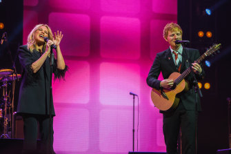 Kylie Minogue and Ed Sheeran perform at the state memorial for Michael Gudinski.