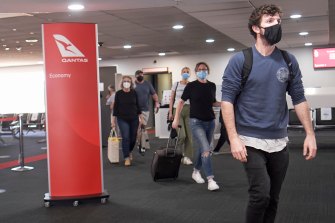 Masks are now mandatory on all international and domestic flights as governments battle to stop a highly infectious strain of coronavirus from taking hold in Australia.