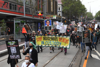 Protesters march down Bourke Street on Tuesday.